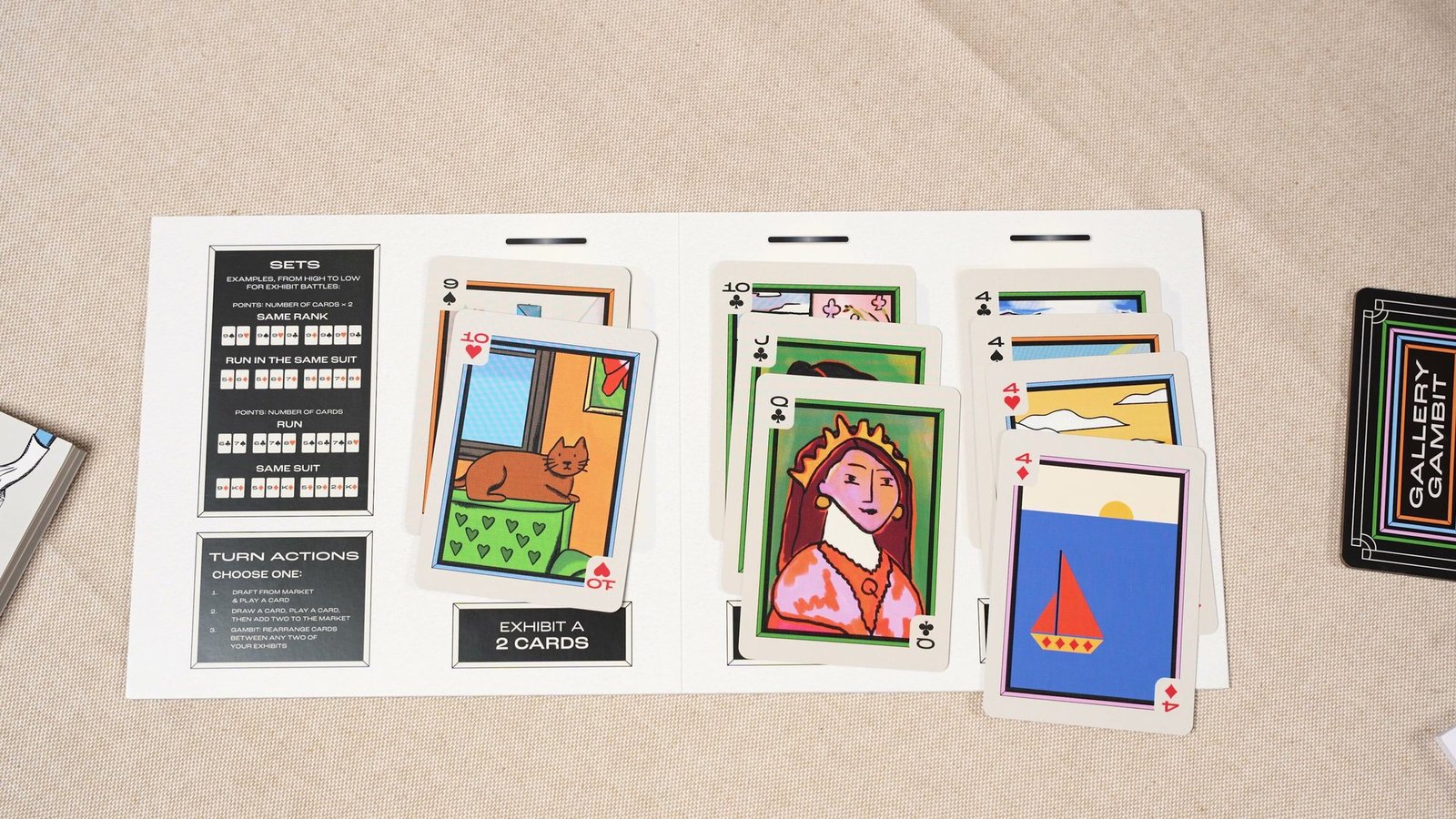 A finished player board with three Exhibitions of two, three and four painted cards.